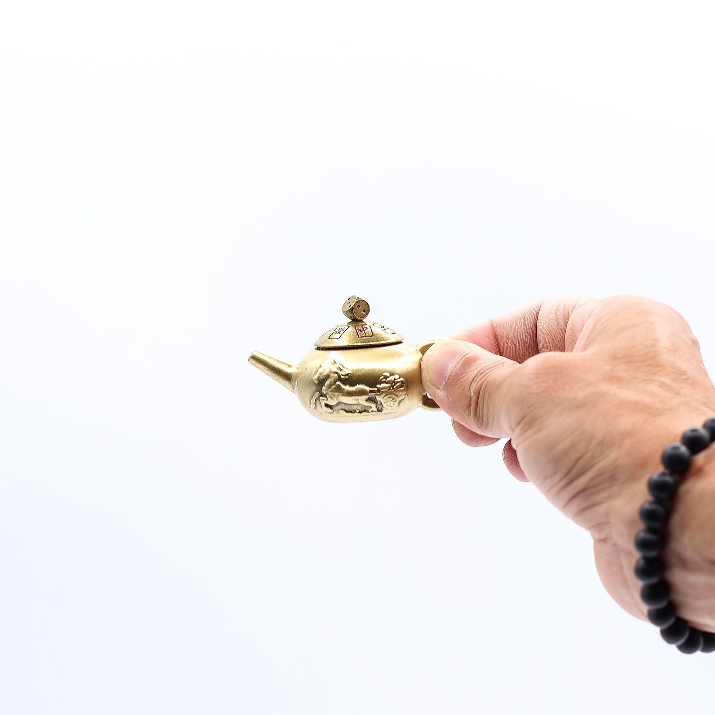 Brass Feng Shui Teapot Spinner – 8x4.5 CM held in hand, brass teapot spinner with engraved details on white background