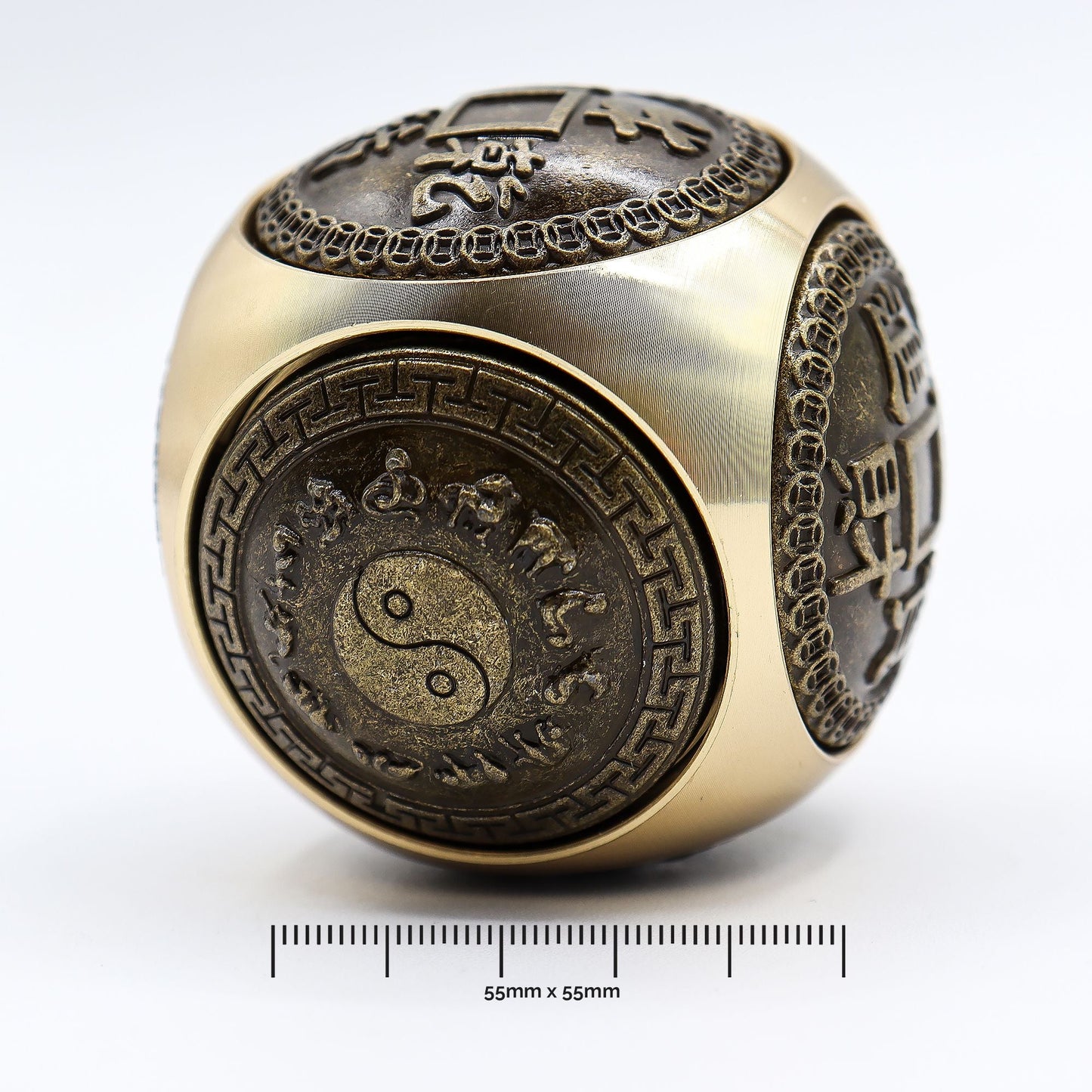 Brass Feng Shui Wealth Spinner – 5.5 CM brass spinner with yin yang and Chinese motif panels, 55mm size shown