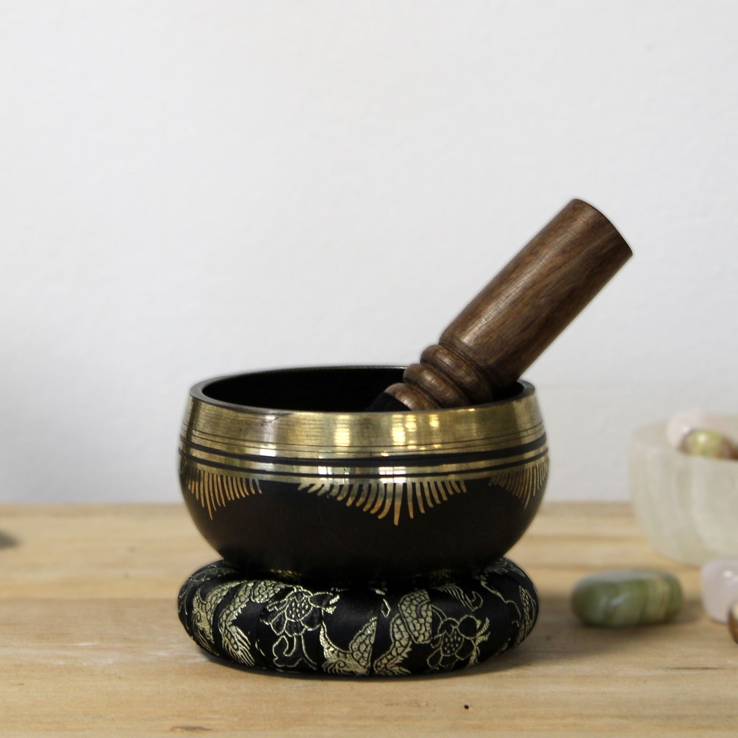 Alt Tag: Brass Flower of Life Singing Bowl Set – 9x5 CM with wooden mallet and ring pillow, brass meditation bowl on tabletop