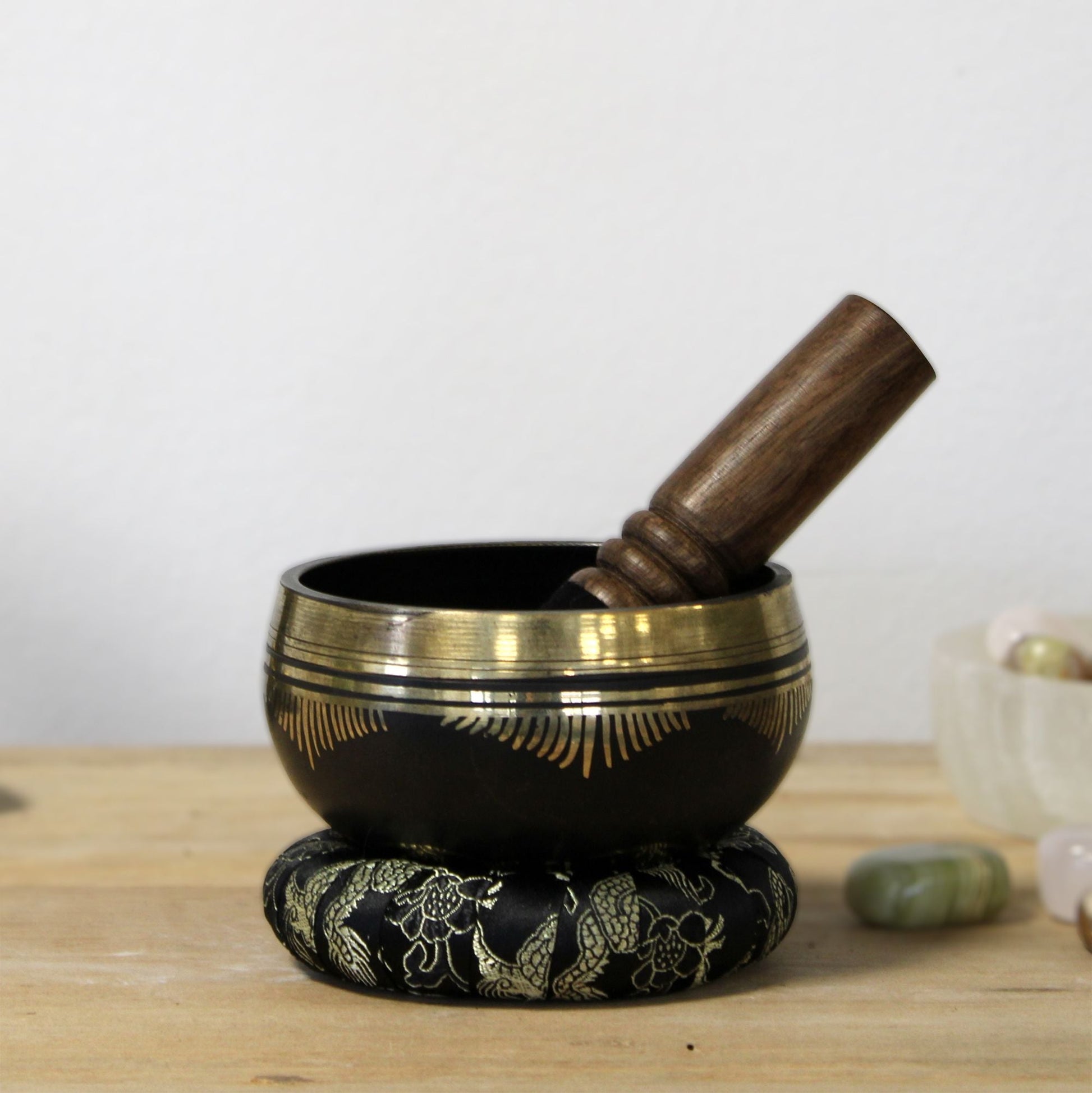 Alt Tag: Brass Flower of Life Singing Bowl Set – 9x5 CM with wooden mallet and ring pillow, brass meditation bowl on tabletop