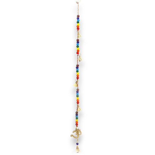 Alt Tag: Brass OM Indian Chimes – 53CM with Chakra Beads hanging brass OM symbol chime with multicolor chakra beads on white background