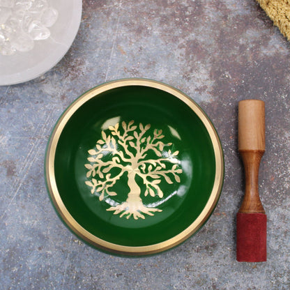 Alt Tag: Brass Tree of Life Singing Bowl Set – Green 14CM green brass bowl with Tree of Life design and wooden mallet on stone surface