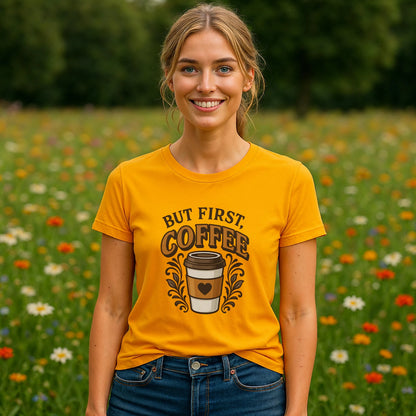 But First Coffee 100% Organic Cotton T-Shirt on model wearing yellow graphic tee with coffee cup design outdoors