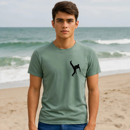 Capoeira Kick 100% Organic Cotton T-Shirt on model wearing green tee with capoeira kick graphic at beach