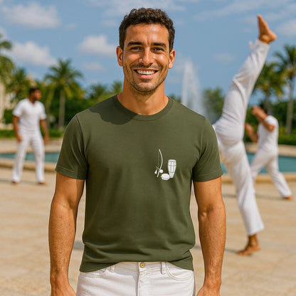Alt Tag: Capoeira Music Sustainable Unisex Tee on model in green, minimalist berimbau graphic, outdoor training scene