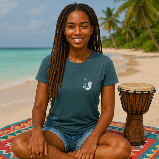 Alt Tag: Capoeira Music Sustainable Unisex Tee worn by person on beach, teal tee with small berimbau and drum graphic