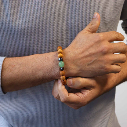 Cedarwood Chakra Bangle – Green Aventurine bracelet on wrist, cedarwood beads with green aventurine and black accent beads