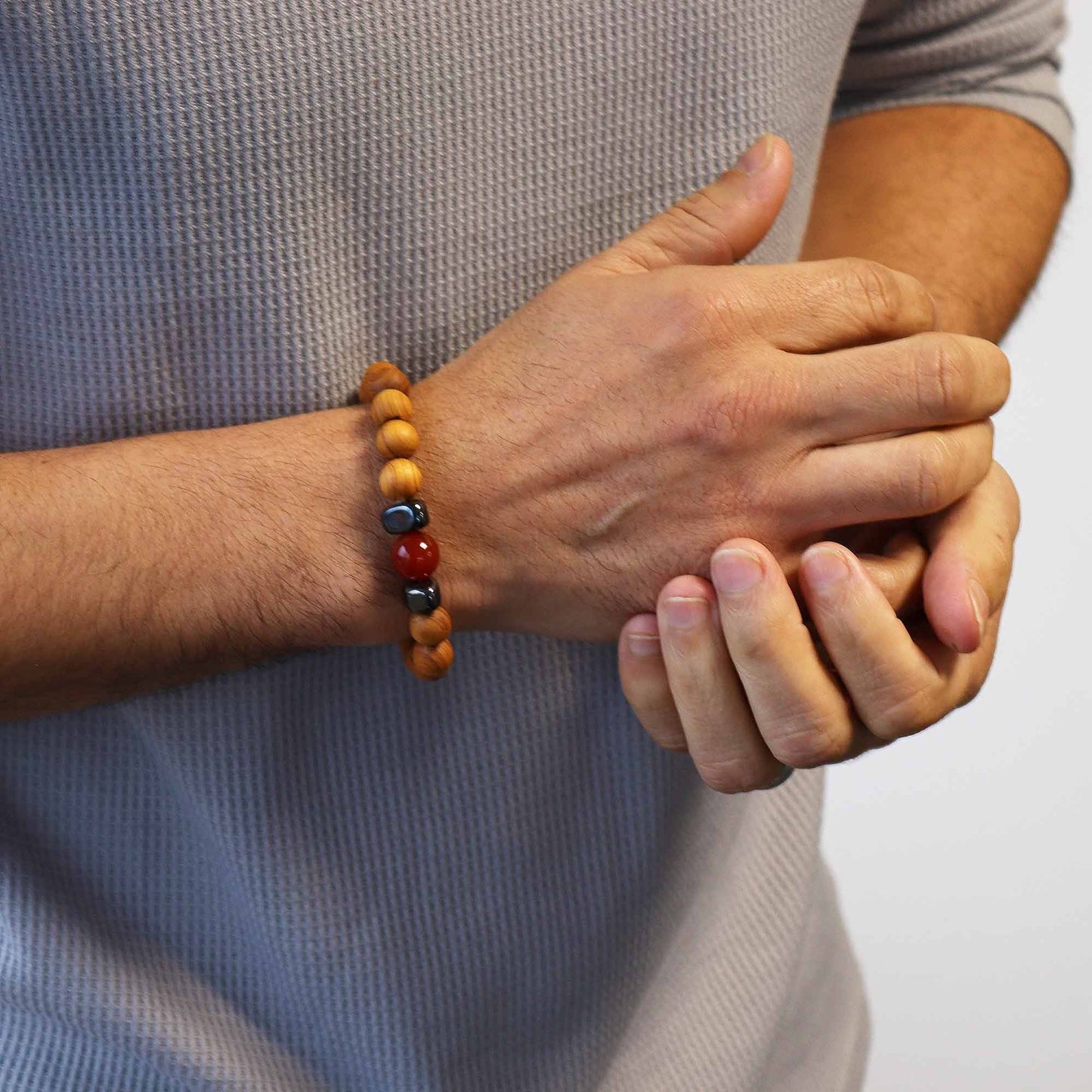 Alt Tag: Cedarwood Chakra Bangle – Red Jasper, 7x7 CM bracelet on wrist, natural cedarwood beads with red jasper gemstone accents