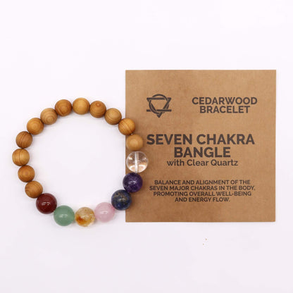 Cedarwood Seven Chakra Bangle – Natural Beads bracelet with cedarwood beads, seven chakra stones and clear quartz, shown beside product card