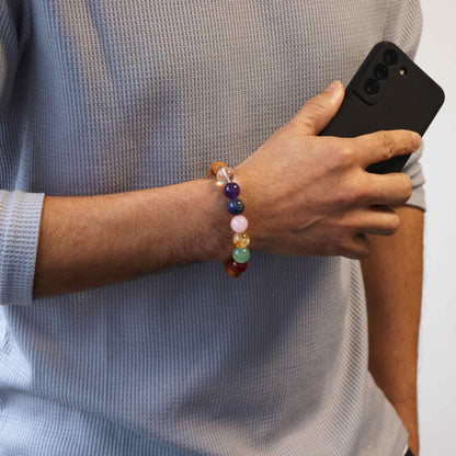 Cedarwood Seven Chakra Bangle – Natural Beads on wrist with multicolor chakra stone beads bracelet lifestyle photo