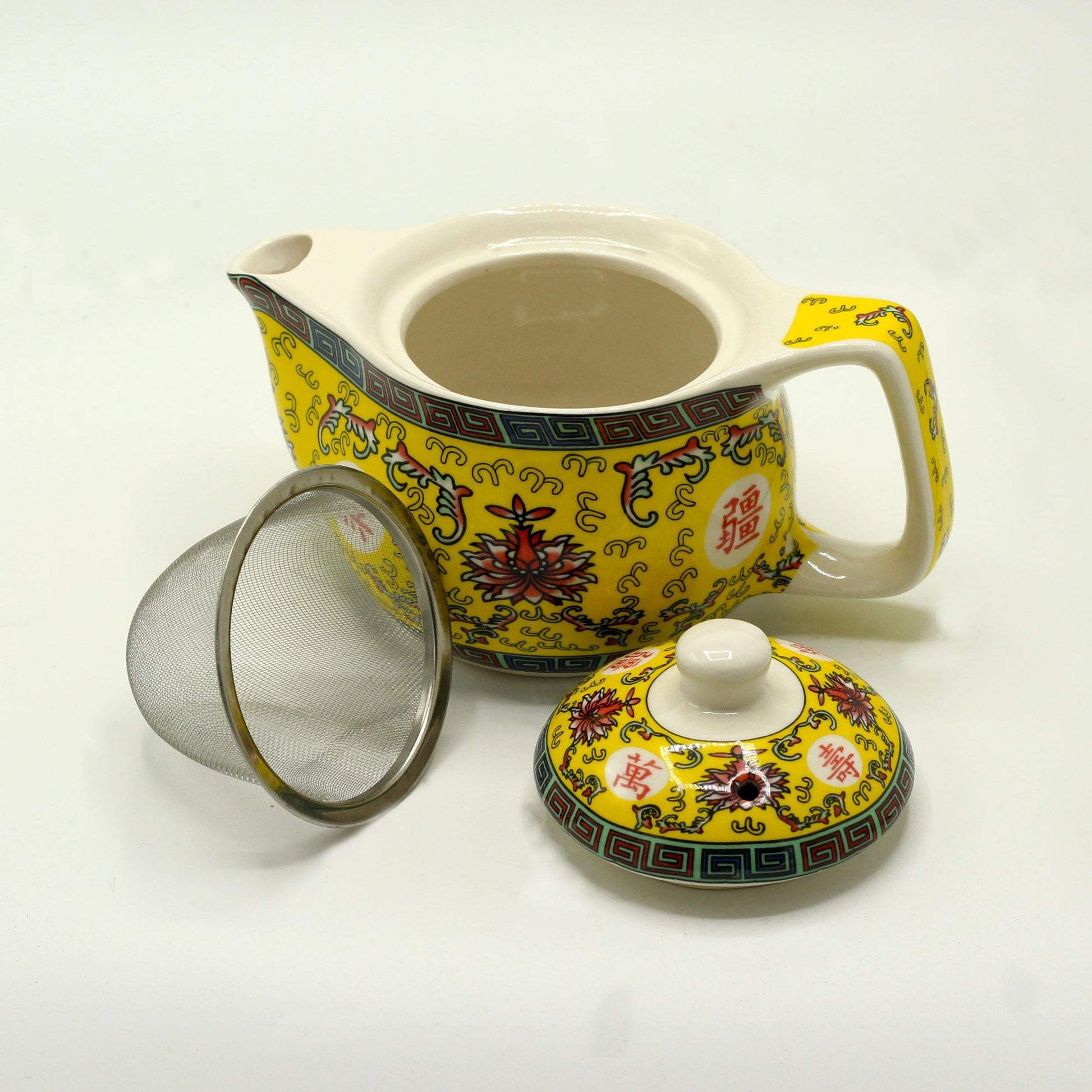 Alt Tag: Ceramic Herbal Teapot – 350ML Long Life Design yellow ceramic teapot with lid and metal strainer, traditional floral pattern