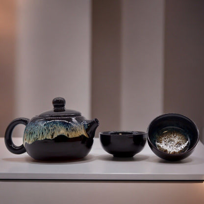 Ceramic Herbal Teapot Set – 19x12.5x9 CM black glazed ceramic teapot with matching cups on display