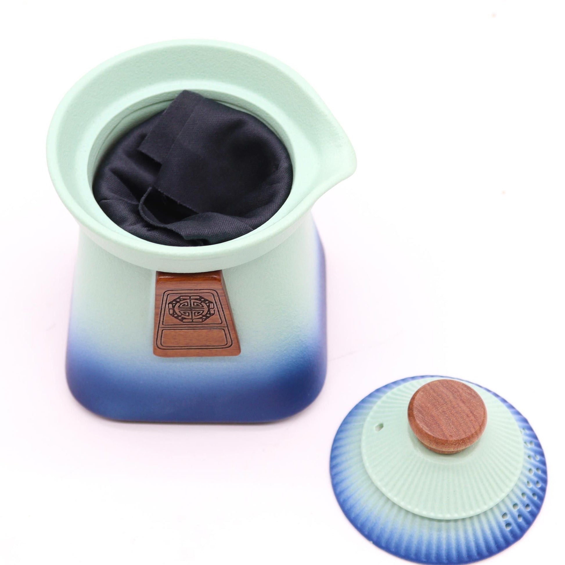 Alt Tag: Ceramic Herbal Teapot Set – Blue Heaven Edition teapot with blue gradient ceramic body, fabric infuser pouch, and matching lid