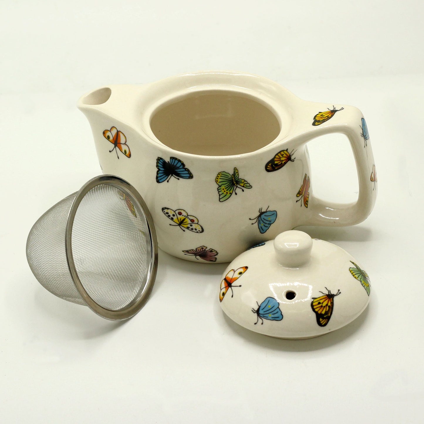 Alt Tag: Ceramic Herbal Teapot Set – Butterflies 350ML, tetera de cerámica con diseño de mariposas, tapa y filtro colador de acero inoxidable