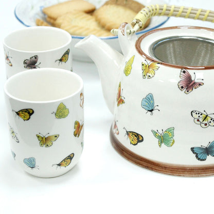 Alt Tag: Ceramic Herbal Teapot Set – Butterflies – 6 Cups, teapot with butterfly design and two matching ceramic cups, built-in infuser