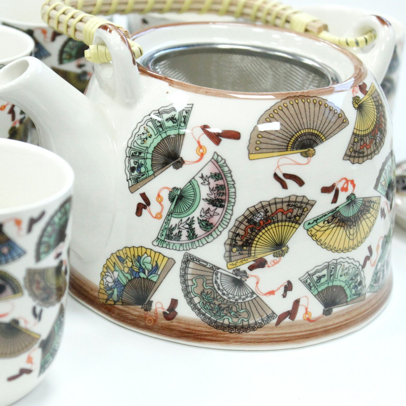 Alt Tag: Ceramic Herbal Teapot Set – China Fans Design ceramic teapot with metal strainer and matching cup, colorful fan pattern