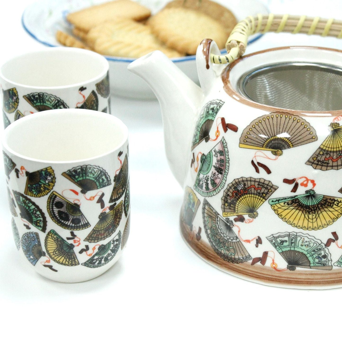 Alt Tag: Ceramic Herbal Teapot Set – China Fans Design with ceramic teapot, metal strainer and matching cups, fan pattern