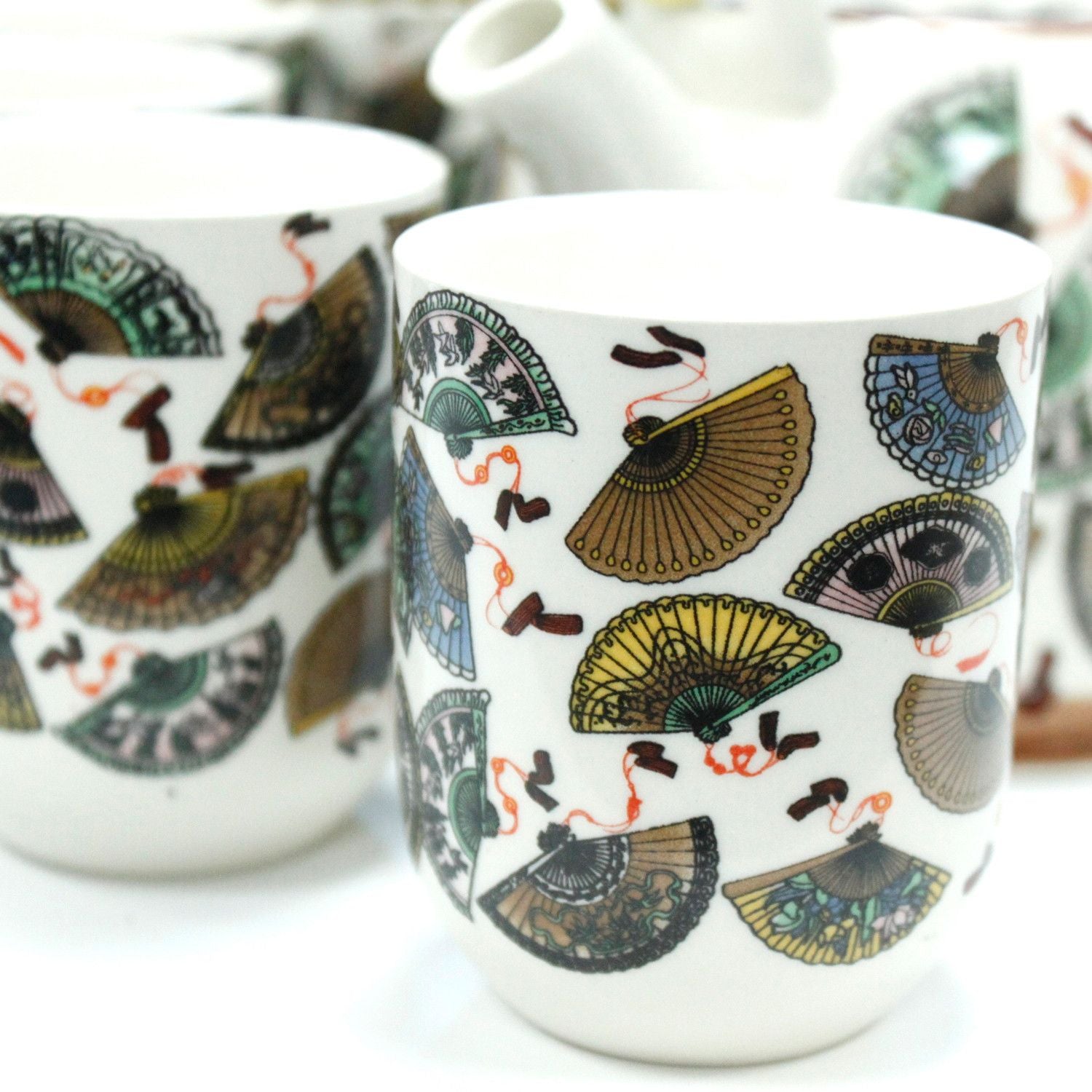 Ceramic Herbal Teapot Set – China Fans Design matching ceramic tea cup with colorful fan pattern close-up