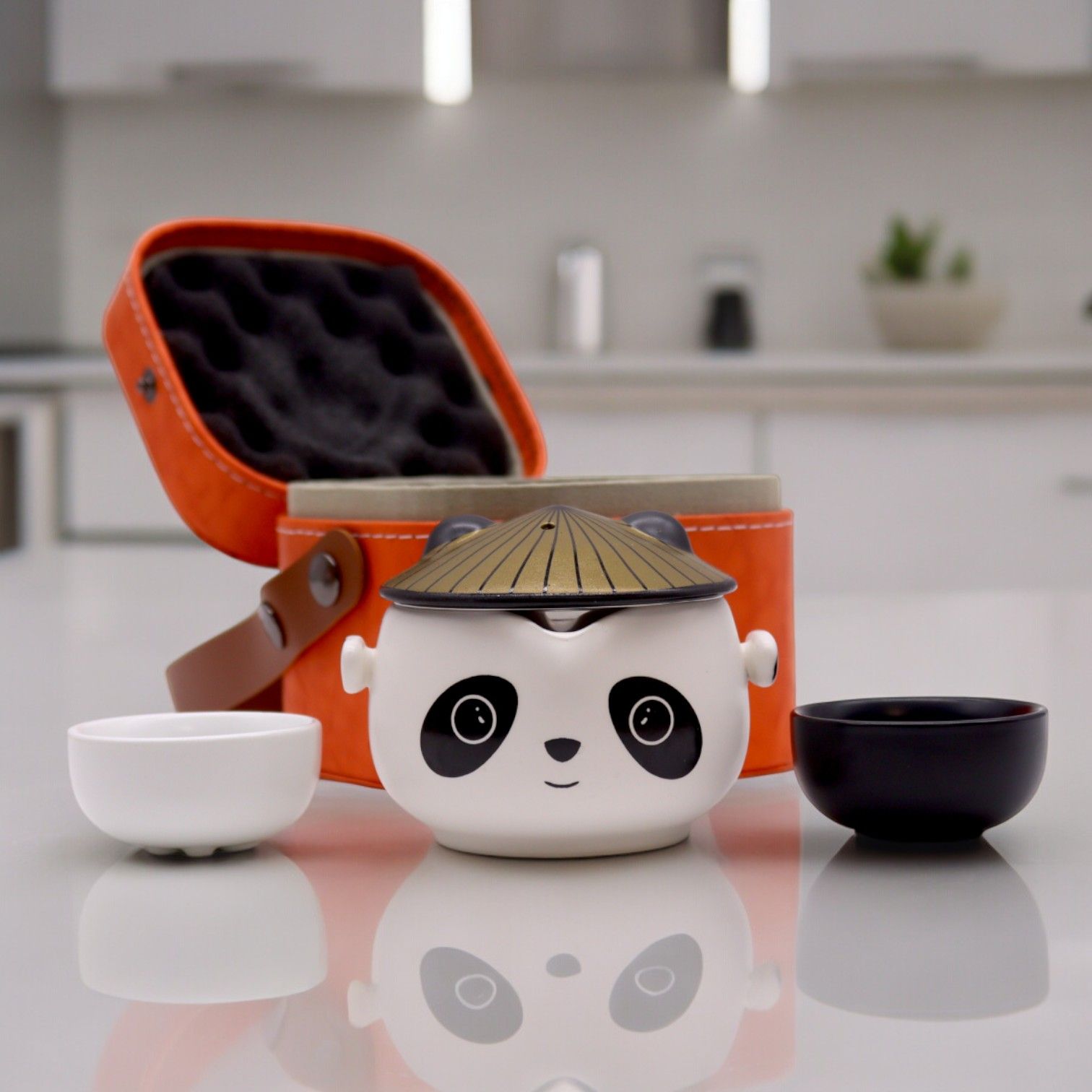 Ceramic Herbal Teapot Set – 2 Cups & Travel Case with panda ceramic teapot, two cups, and orange travel case