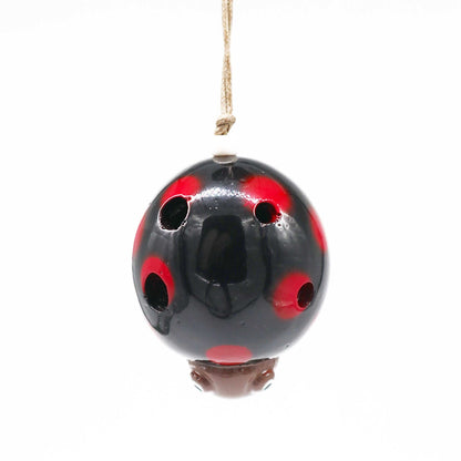 Ceramic Ocarina – Ladybird Design hanging ceramic ocarina with red and black ladybird glaze, front view
