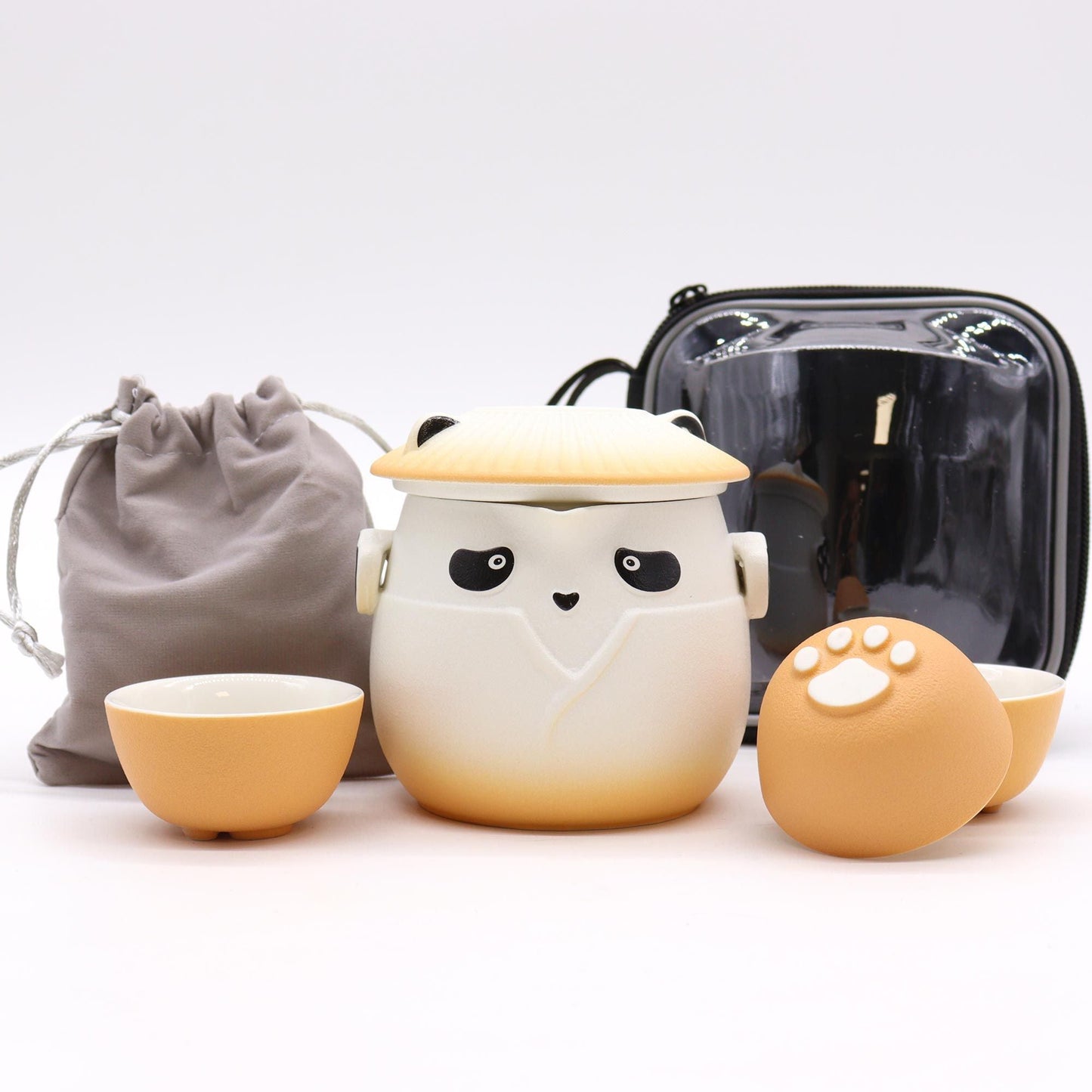 Alt Tag: Ceramic Panda Teapot Set – Orange with panda ceramic teapot, three orange cups, and travel storage bags