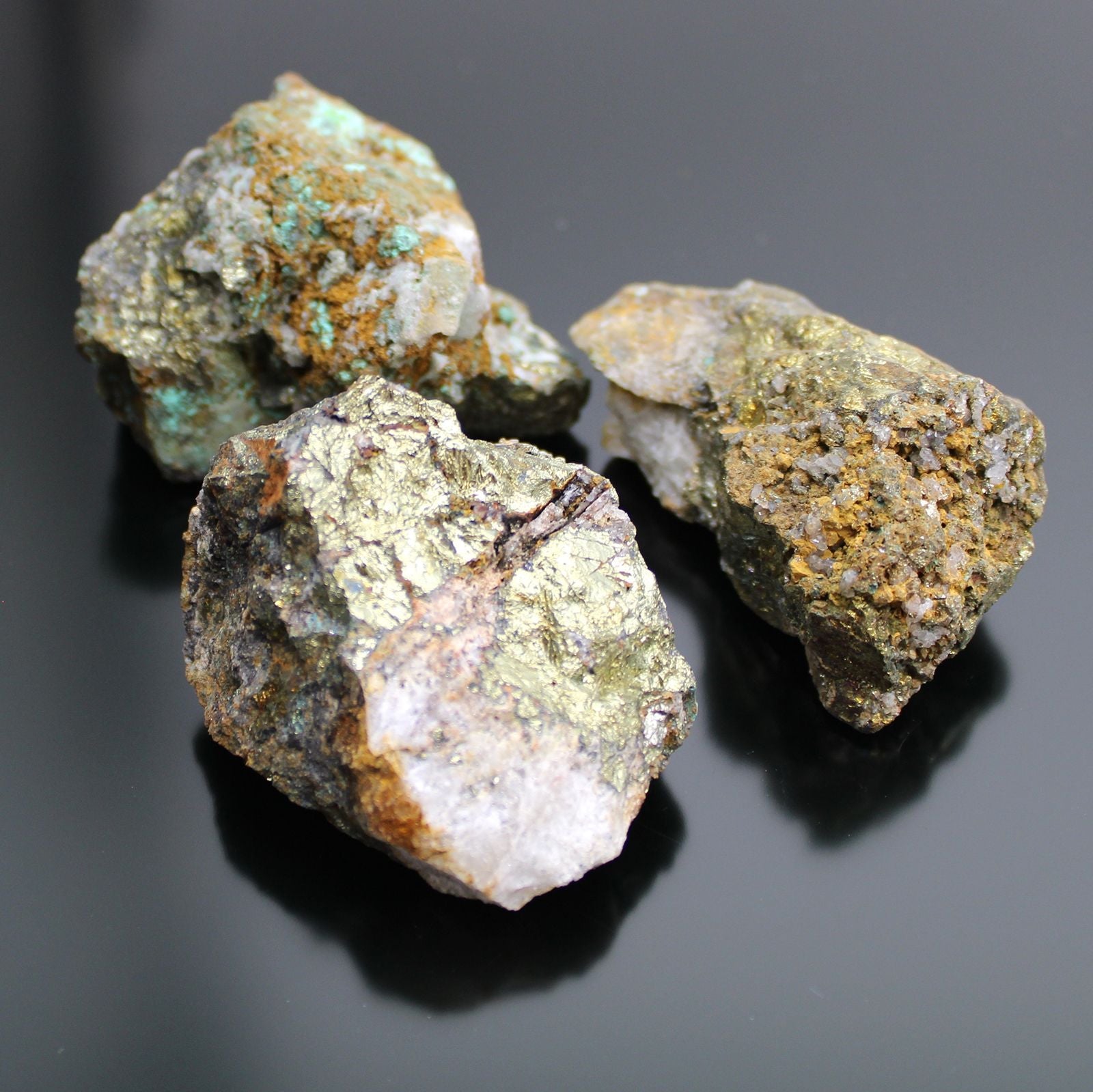 Alt Tag: Chalcopyrite Mineral Collection – Approx. 80 Pieces, raw chalcopyrite mineral specimens with metallic gold luster on black background