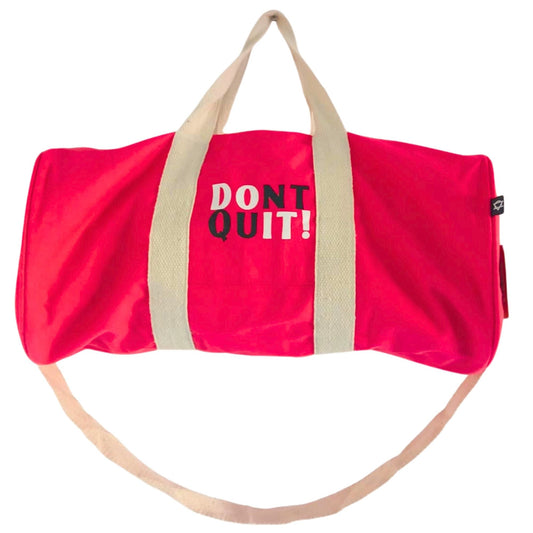 Alt Tag: Cherry Pink Gym Bag – 100% Cotton with cream handles and “DON’T QUIT!” print, duffel-style cotton bag on white