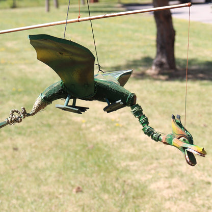 Alt Tag: Coconut Dragon Mobile – 37CM handmade coconut dragon hanging mobile decoration in green, suspended outdoors