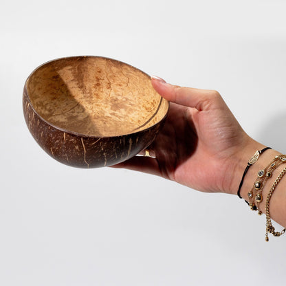 Coconut Shell Bowl – 6x13 CM handmade coconut shell bowl held in hand, natural interior, medium size