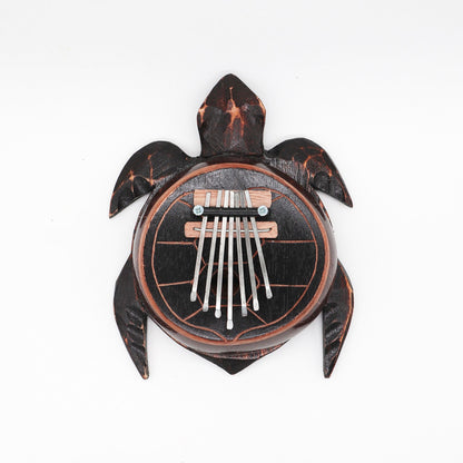 Alt Tag: Coconut Shell Thumb Piano – Antique Turtle Design, turtle-shaped coconut shell kalimba with metal tines, top view