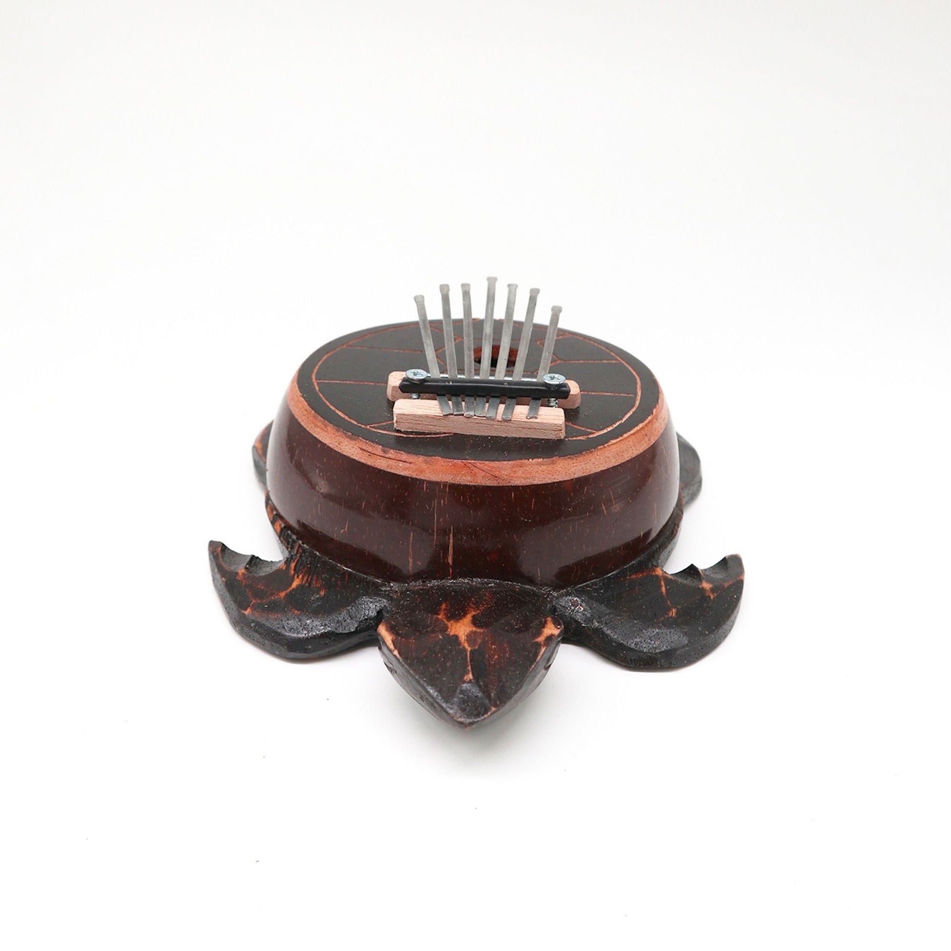 Alt Tag: Coconut Shell Thumb Piano – Antique Turtle Design, handcrafted Bali kalimba with etched turtle coconut shell on white background