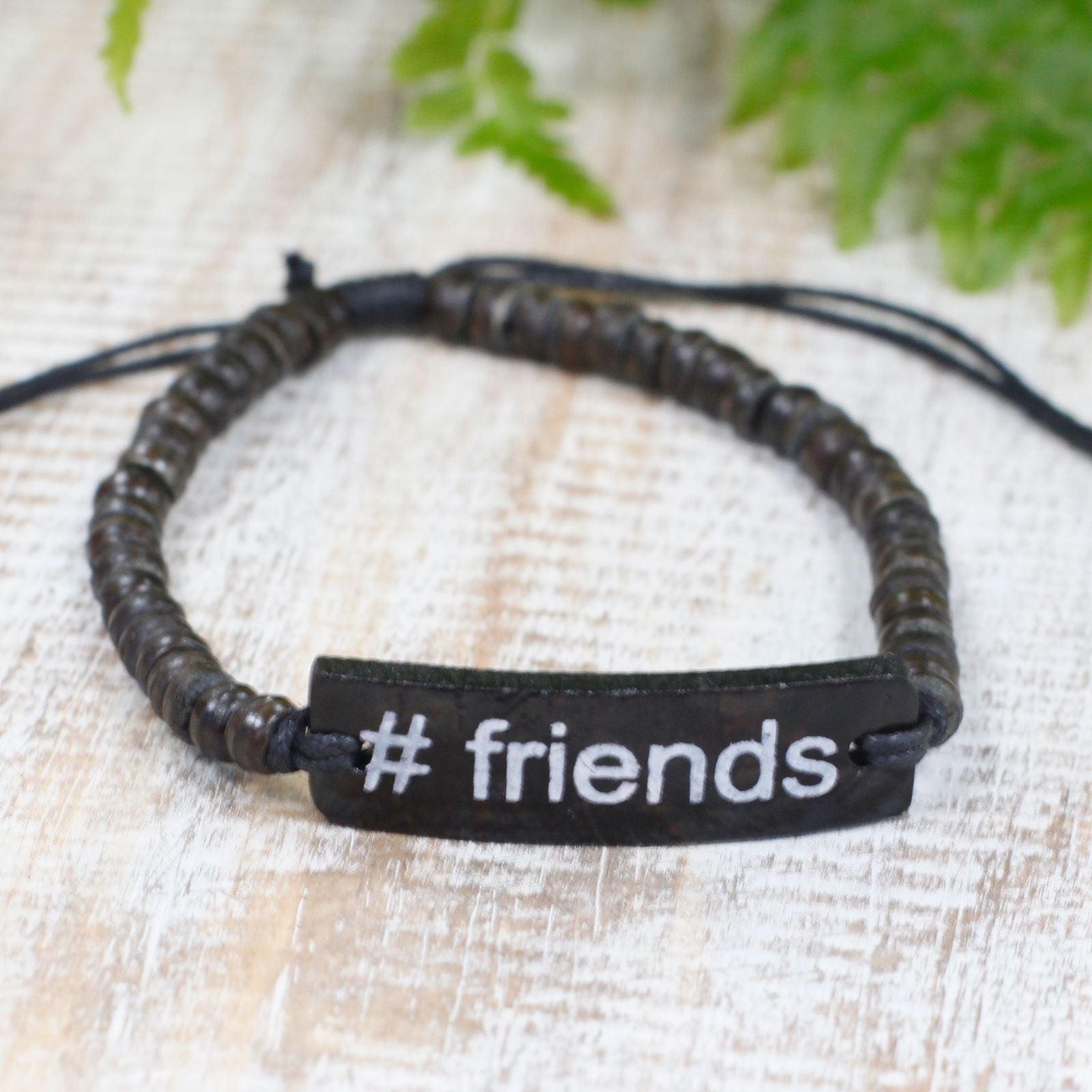 Alt Tag: Coconut Wood Friends Bracelet – Adjustable with #friends charm, dark coconut wood beads and adjustable cord closure
