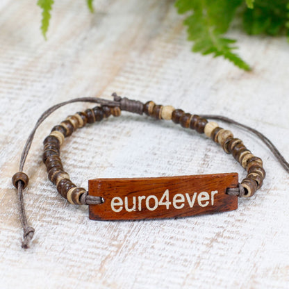 Alt Tag: Coconut Wood Slogan Bracelet – Stretch 7.5 CM coconut wood beaded bracelet with engraved euro4ever slogan on rustic background