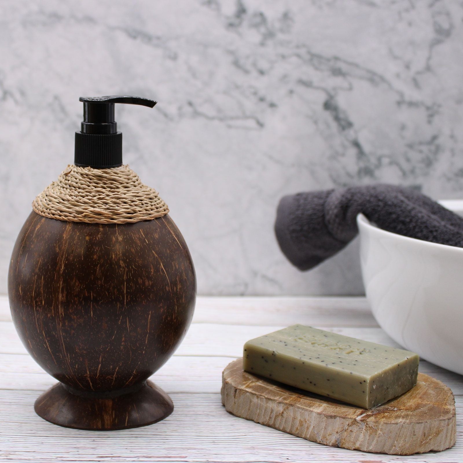 Coconut Wood Soap Dispenser – 150ML on bathroom counter with pump top, marble backdrop, soap bar on dish and towel