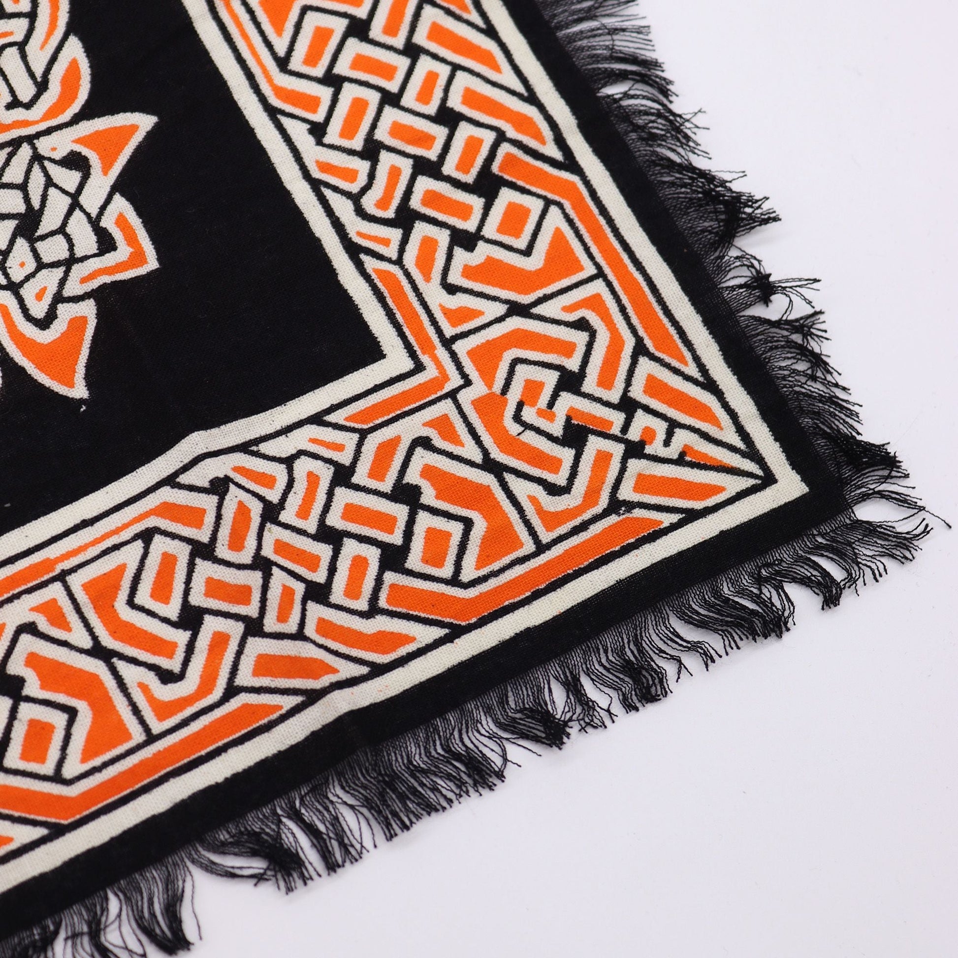 Alt Tag: Cotton Esoteric Altar Cloth – Earth Mother black cotton altar cloth corner with orange geometric border and fringed edge