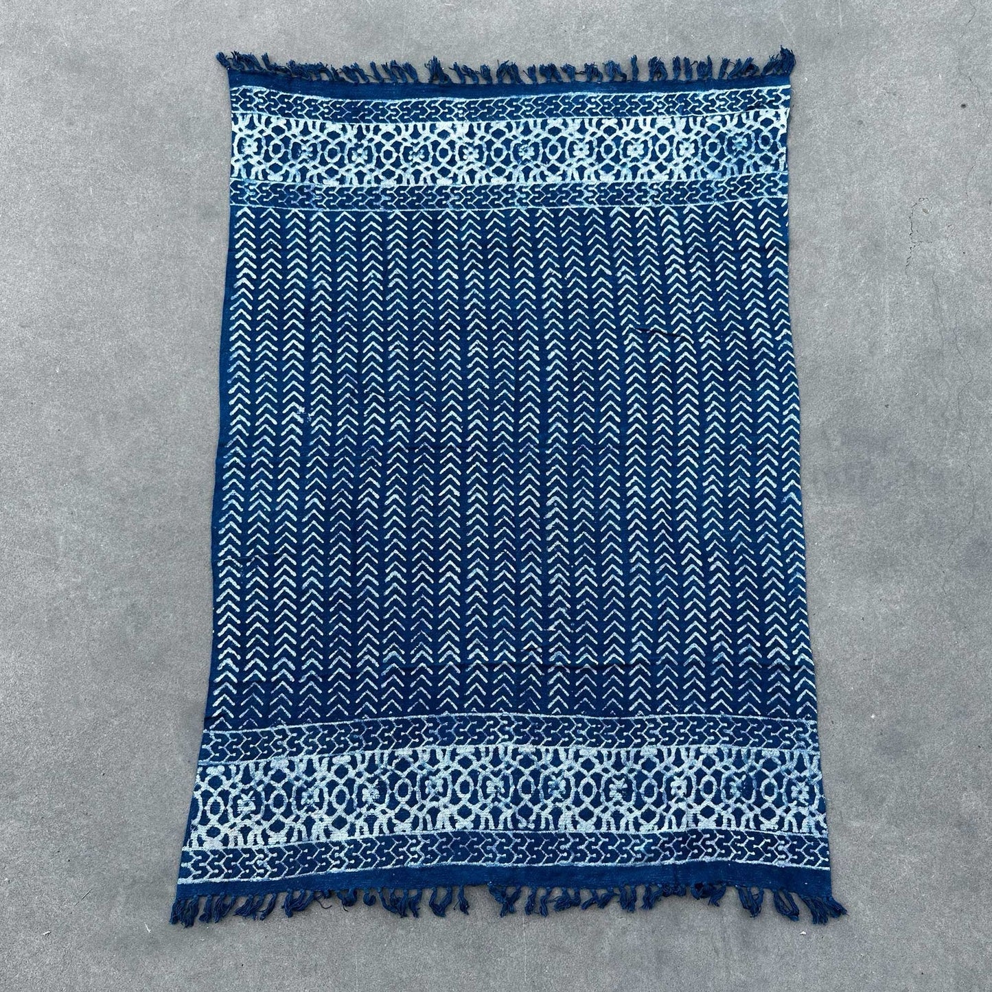 Cotton Handmade Indigo Throw – 170x120 CM blue indigo-dyed cotton throw with white geometric pattern and fringed edges