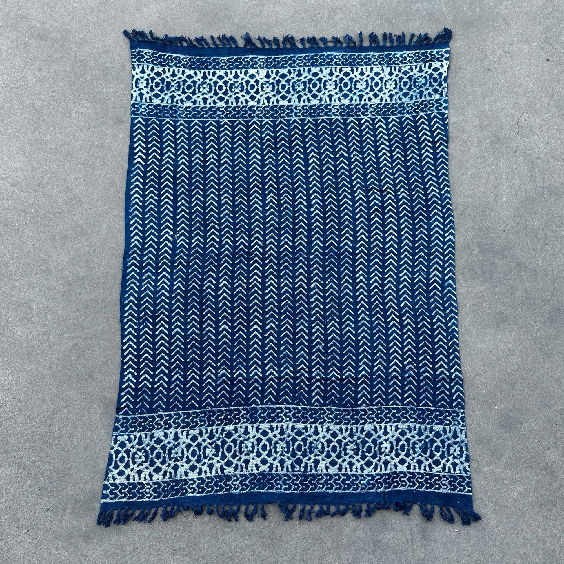 Cotton Handmade Indigo Throw – 170x120 CM blue indigo-dyed cotton throw with white geometric pattern and fringed edges