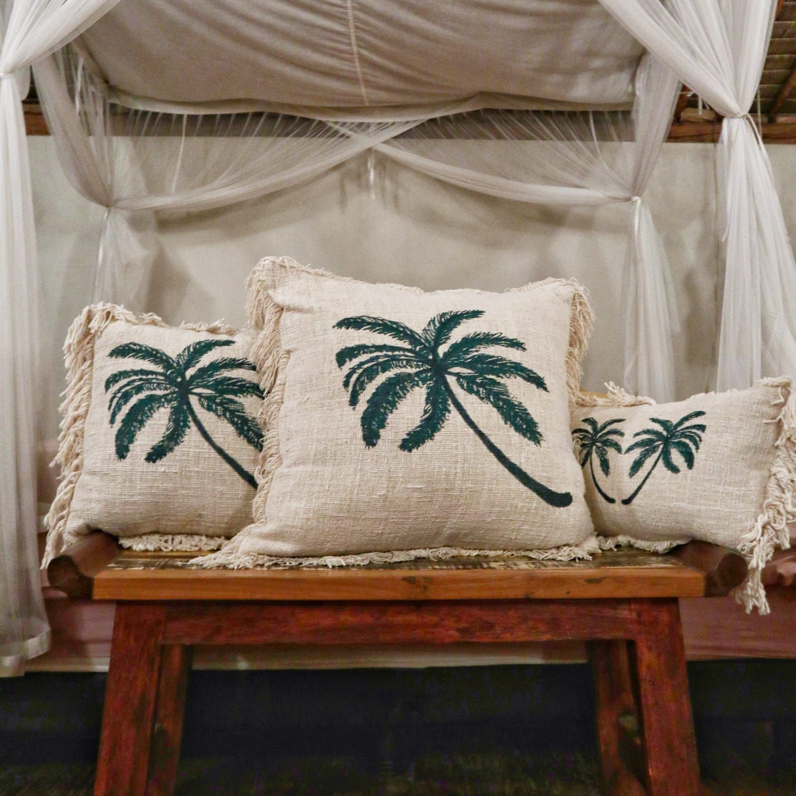 Alt Tag: Cotton Linen Cushion – 30x50 CM Palm Tree Fringe on wooden bench, beige cushion with green palm print and fringe