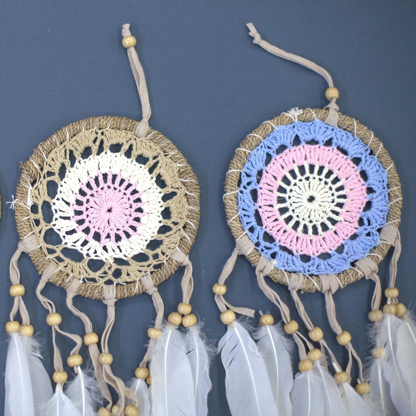 Cotton Macramé Dream Catcher – 12 CM Pastel Delight, handcrafted Bali cotton crochet dreamcatchers with pastel pink and blue rings, feathers