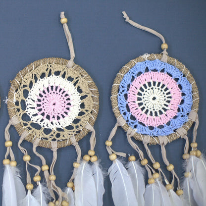 Cotton Macramé Dream Catcher – 12 CM Pastel Delight, handcrafted Bali cotton crochet dreamcatchers with pastel pink and blue rings, feathers