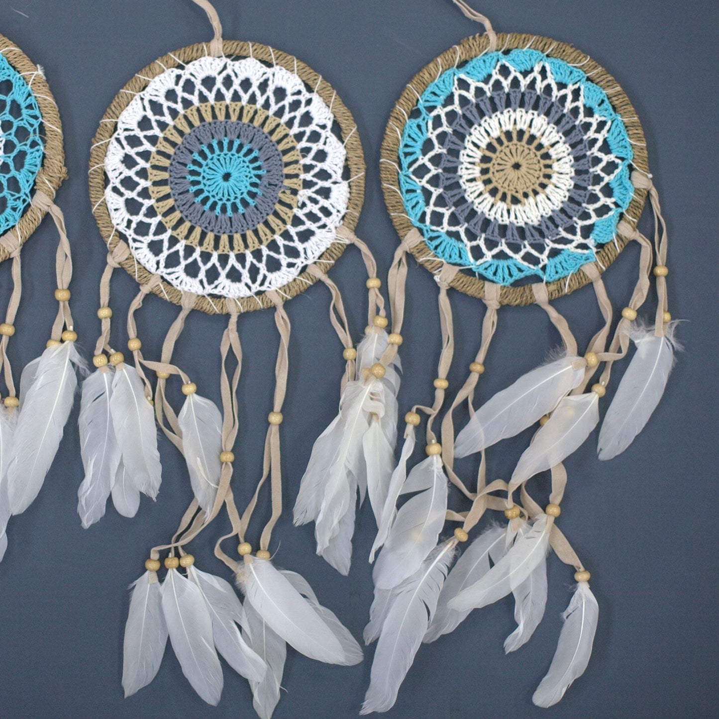 Cotton Macramé Dream Catcher – 16CM Pastel Blue handmade cotton macramé wall hanging with pastel blue details and white feathers