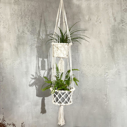 Cotton Macrame Pot Holder – Double Hanger in natural cotton with two hanging plant baskets against a gray textured wall