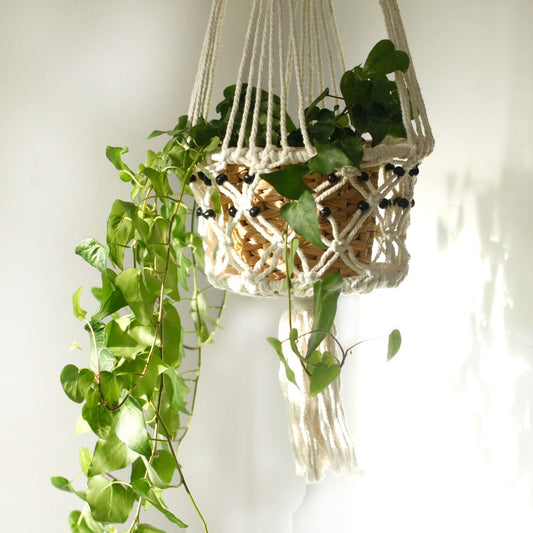 Alt Tag: Cotton Macrame Pot Holder – Large Beaded hanging cotton macrame plant holder with black beads and trailing green plant