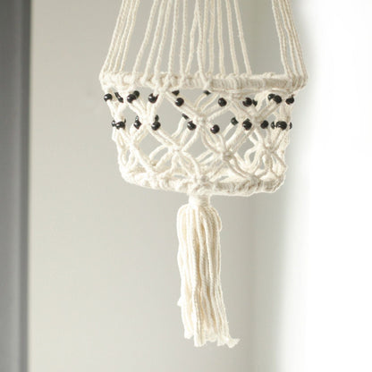 Alt Tag: Cotton Macrame Pot Holder – Large Beaded, white cotton hanging planter holder with black beads and tassel