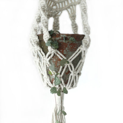 Cotton Macrame Pot Holder – Long Rattan Hoop 100 CM holding a rustic terracotta planter with trailing greenery
