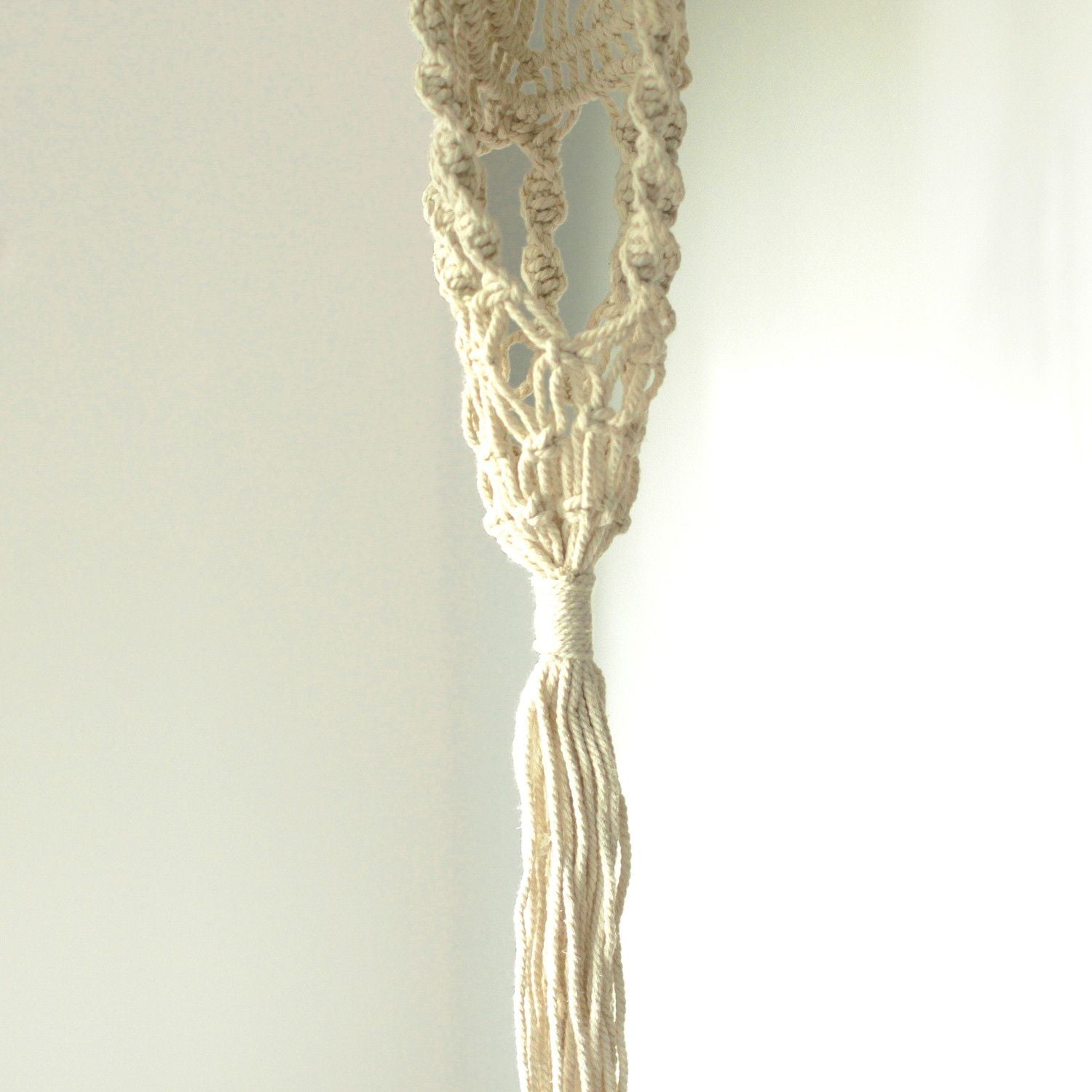Alt Tag: Cotton Macrame Pot Holder – Long Rattan Hoop 100 CM natural cotton macrame plant hanger close-up with knotted tassel
