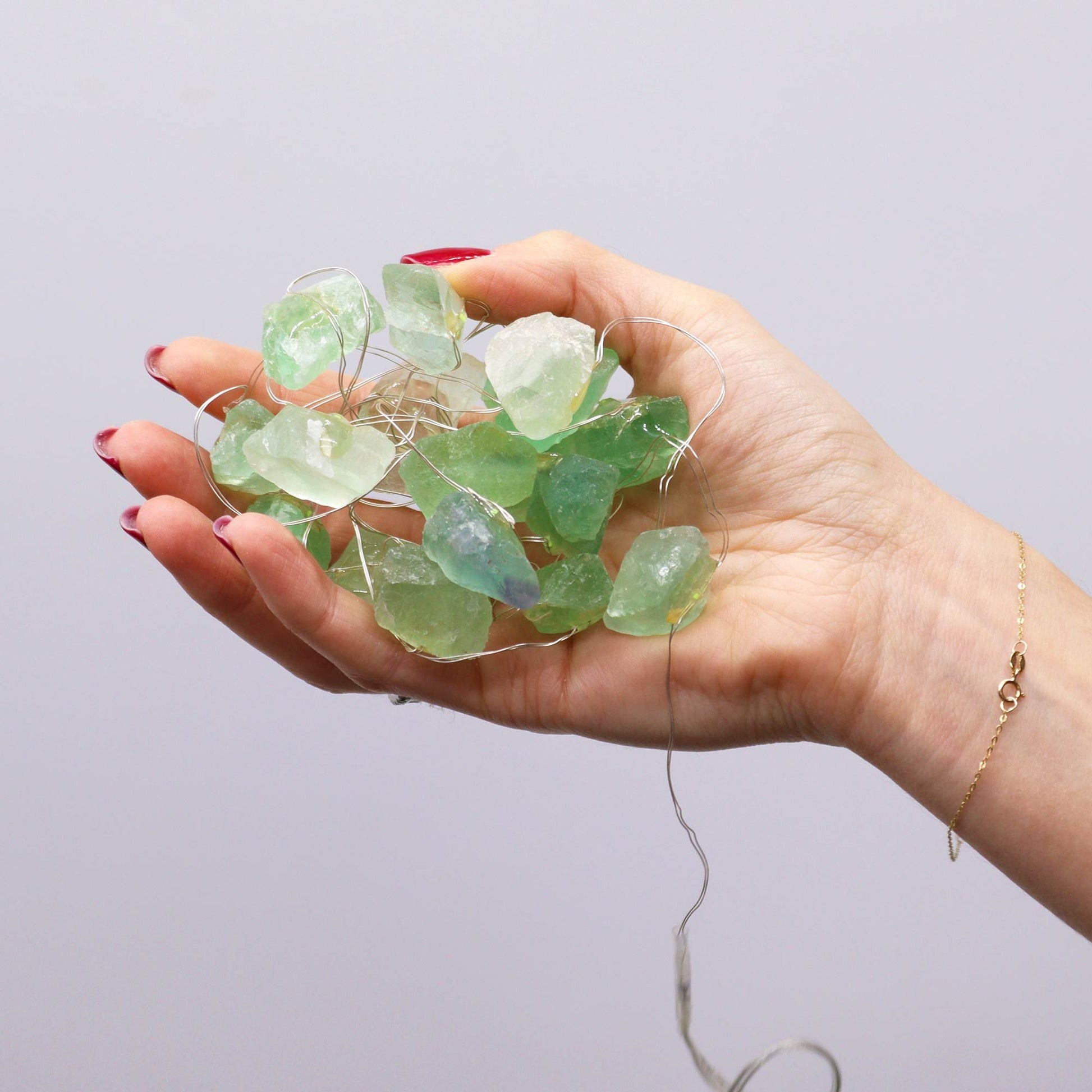 Crystal Jade Gemstone Enchantment Lights – Decorative String held in hand with green jade stones on wire fairy light string
