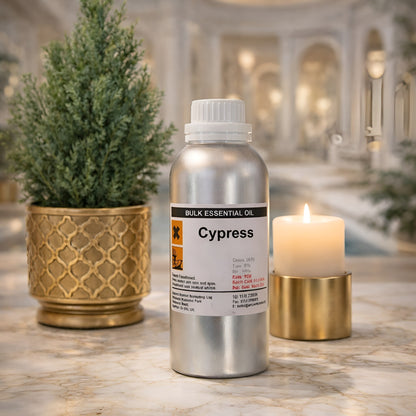 Alt Tag: Cypress Essential Oil – 0.5KG Bulk aluminum bottle on marble countertop with candle and potted plant in spa setting