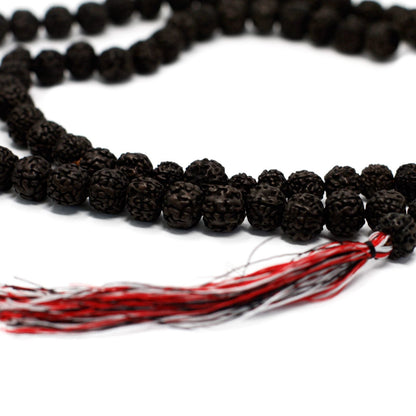 Dark Wood Beads Rudraksha Mala – 108 CM with textured black beads and red tassel, close-up on white background