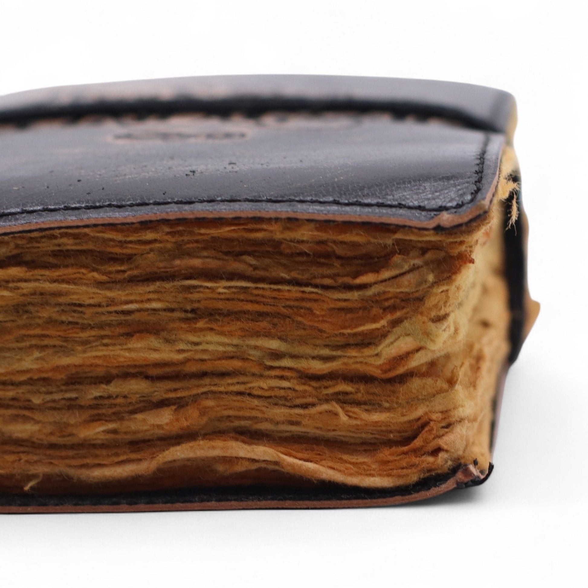 Deckled Edge Leather Notebook – 9x13 CM - The Stories I Tell Myself close-up of deckled-edge pages and leather cover